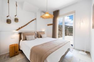 Postel nebo postele na pokoji v ubytování VATHI BLEU PRIVATE VILLAS + 259 fotografií