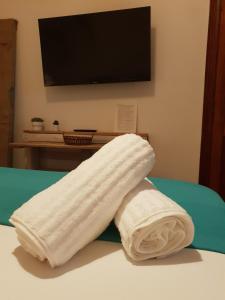 a pair of towels sitting on top of a bed at Cactus Host in Las Palmas de Gran Canaria