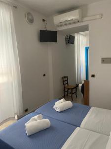 Letto o letti in una camera di Caravella