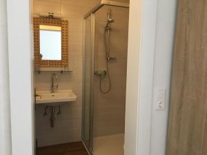 a bathroom with a shower and a sink at Haus Marjanne in Niederau +28 photos