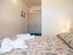 Giường trong phòng chung tại Il Blu Tanca Piras