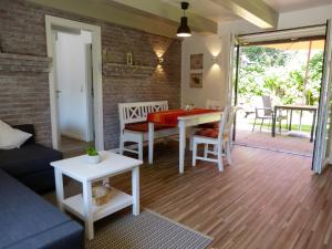 a living room with a couch and a table at Krögerhof in Manhagen +9 photos