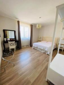 Postel nebo postele na pokoji v ubytování Santa Lucia B&B