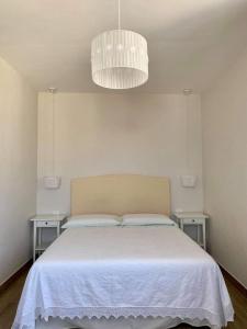 Postel nebo postele na pokoji v ubytování Santa Lucia B&B
