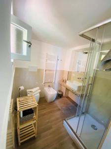 a bathroom with a shower and a toilet and a sink at Santa Lucia B&B in Gaeta