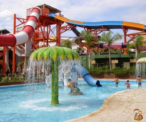a water park with a water slide and people in the water at Avenida del Mar 14 Junio in Castellón de la Plana
