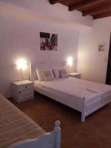 Voodi või voodid majutusasutuse Traditional Apartments Plagiaki toas