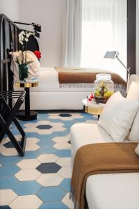 A bed or beds in a room at Magnolia Boutique Rooms
