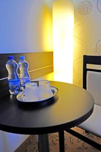 a table with a white table cloth on top of it at Hotel Czardasz Spa & Wellness in Płock