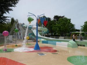 a water park with a water slide at Camping Paradis Aloé in Médis +22 photos