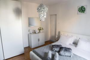Posteľ alebo postele v izbe v ubytovaní Casa Tosić