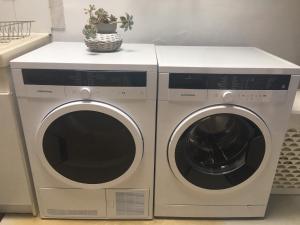 two washing machines are sitting next to each other at maison Basque Maïana in Anglet