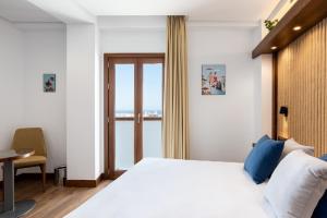 Postel nebo postele na pokoji v ubytování Hotel Antantie
