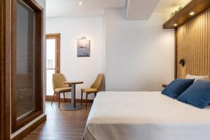Postel nebo postele na pokoji v ubytování Hotel Antantie