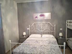Säng eller sängar i ett rum på B&B A Casa di Lilla