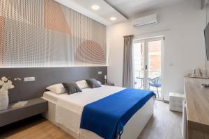 Apartments Jakic 1 tesisinde bir odada yatak veya yataklar