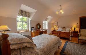 Voodi või voodid majutusasutuse Lis-Ardagh Lodge toas