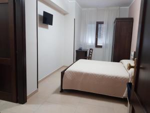 En eller flere senge i et værelse på Affittacamere il Tuffatore