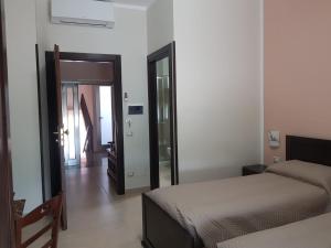 En eller flere senge i et værelse på Affittacamere il Tuffatore