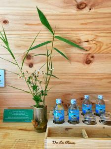 a group of blue bottles of water on a table at Homestay De la Rosa - Côn Đảo in Con Dao