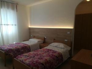 Postel nebo postele na pokoji v ubytování Albergo Ristorante Sargas