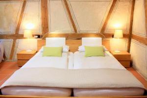 Postel nebo postele na pokoji v ubytování D & S Hotel & Ferienwohnungen