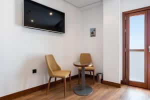 TV a/nebo společenská místnost v ubytování Hotel Antantie