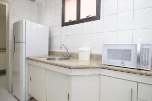 Кухня или мини-кухня в 360 Santa Cecília
