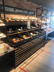 a bakery with racks of breads and pastries at B&B Waddenzeetexel in Oudeschild