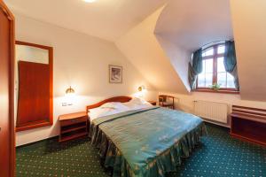 Postel nebo postele na pokoji v ubytování AGH Hotel + 37 fotografií