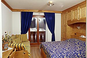 Postel nebo postele na pokoji v ubytování Agriturismo Prati Oitzinger