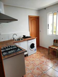 A kitchen or kitchenette at Apartamento vistas al mar - Coveta Fuma