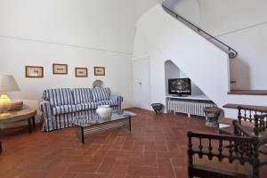 a living room with a couch and a table at Villa Stella in Massa Lubrense