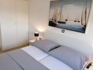 Postel nebo postele na pokoji v ubytování Apartmani Karla