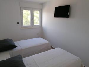 Postel nebo postele na pokoji v ubytování Apartmani Karla