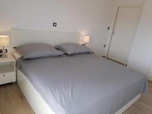 Postel nebo postele na pokoji v ubytování Apartmani Karla