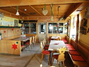 a dining room with tables and chairs in a restaurant at Hotel Wirtshaus Krone in Friedrichshafen