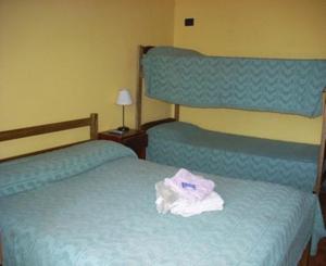 Postel nebo postele na pokoji v ubytování El Guembe Hostel House