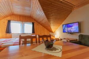 A television and/or entertainment centre at LEVIAL Rooms