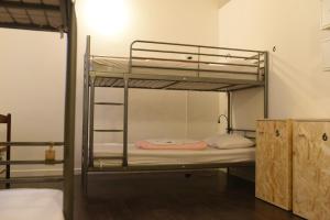 Posteľ alebo postele v izbe v ubytovaní Urban Oasis Hostel