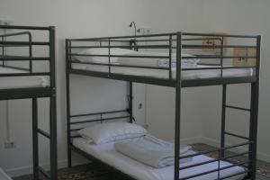 Posteľ alebo postele v izbe v ubytovaní Urban Oasis Hostel