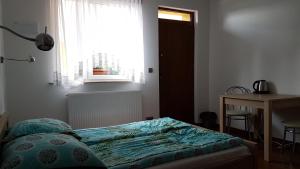 Łóżko lub łóżka w pokoju w obiekcie Victoria