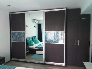 a bedroom with a large sliding glass door at Elena's Terrace in Mamaia