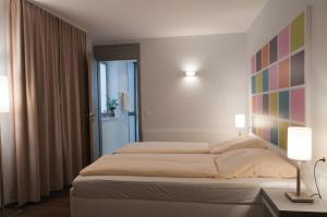 Postel nebo postele na pokoji v ubytování Altstadt Hotel Baunachshof