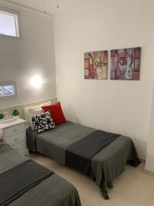 Postel nebo postele na pokoji v ubytování Palmeras Suite Fuengirola