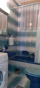 a bathroom with two sinks and a toilet at Harbour in Brgulje +32 photos
