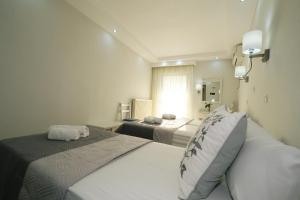Cama ou camas em um quarto em Ifestos Hotel