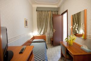 Postel nebo postele na pokoji v ubytování Hotel Emmaus