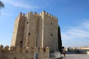 a large castle with a fence in front of it at Duplex Santa Teresa in Córdoba