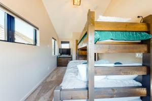 a bedroom with two bunk beds in a house at Woodhaven Hideaway in Frisco